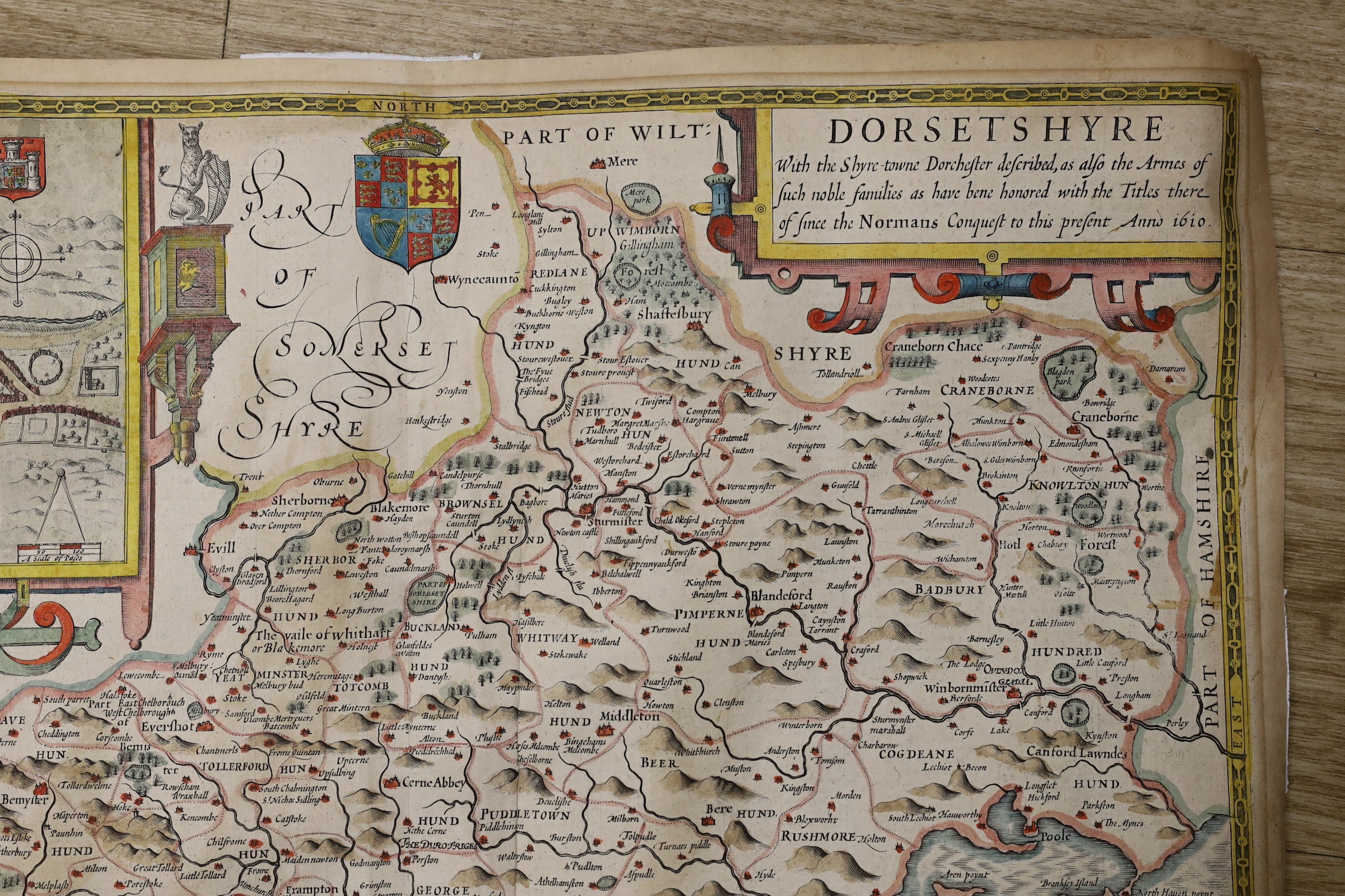 John Speed, (1552-1629) Dorsetshyre, hand coloured map, with the Shire-towne Dorchester described, 40.5cm X 53cm